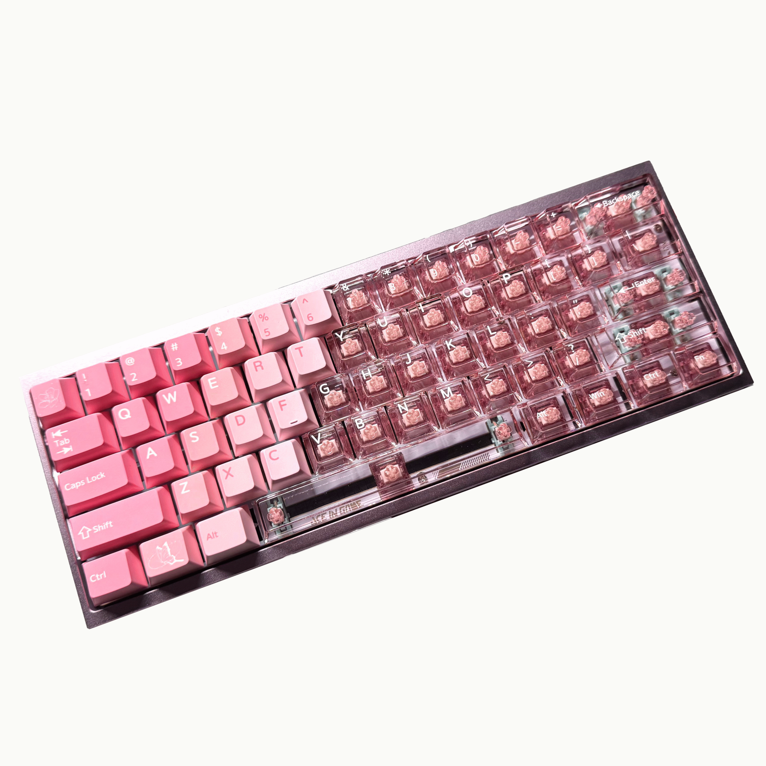Pink cherry blossom keycaps on a mechanical keyboard with RGB lighting.
